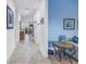 Long hallway with tile flooring, offering views to living room and other rooms at 6216 Kevesta Ave, Palmetto, FL 34221