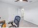 Bright home office with a desk, chair, and access to a bathroom at 6216 Kevesta Ave, Palmetto, FL 34221