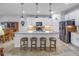 Modern kitchen with white cabinets, granite countertops, and island at 6216 Kevesta Ave, Palmetto, FL 34221