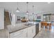 Spacious kitchen with granite countertops, stainless steel appliances, and an island at 6216 Kevesta Ave, Palmetto, FL 34221