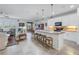 Open concept kitchen with island and stainless steel appliances at 6216 Kevesta Ave, Palmetto, FL 34221