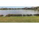 Serene view of a lake with neighborhood homes in the background at 6216 Kevesta Ave, Palmetto, FL 34221