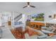 Spacious living room with hardwood floors and a large TV at 6216 Kevesta Ave, Palmetto, FL 34221