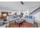 Open living room and kitchen with neutral decor at 6216 Kevesta Ave, Palmetto, FL 34221