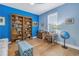 Home office with built-in shelving, hardwood floors, and a desk at 6216 Kevesta Ave, Palmetto, FL 34221