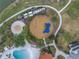 Overhead view of a playground with sand, slides, and play structures at 6216 Kevesta Ave, Palmetto, FL 34221