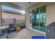 Covered patio with sliding glass doors and lake view at 6216 Kevesta Ave, Palmetto, FL 34221