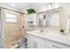 Clean bathroom with white vanity and shower at 6518 Senegal Palm Way, Apollo Beach, FL 33572