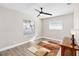 Bright bedroom with large window and wood floors at 6518 Senegal Palm Way, Apollo Beach, FL 33572