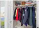 Convenient coat closet with shelves and hanging rod at 6518 Senegal Palm Way, Apollo Beach, FL 33572