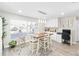 Bright dining area with table and chairs, near a home office at 6518 Senegal Palm Way, Apollo Beach, FL 33572