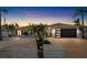 Updated home with modern garage door and attractive landscaping at 6518 Senegal Palm Way, Apollo Beach, FL 33572