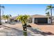 Updated home with modern garage door and attractive landscaping at 6518 Senegal Palm Way, Apollo Beach, FL 33572