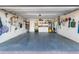 Spacious garage with ample storage and work area at 6518 Senegal Palm Way, Apollo Beach, FL 33572