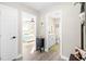 Hallway with views into bedroom and bathroom at 6518 Senegal Palm Way, Apollo Beach, FL 33572