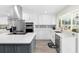 Modern kitchen with stainless steel appliances and large island at 6518 Senegal Palm Way, Apollo Beach, FL 33572