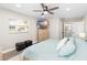 Main bedroom with king-size bed and en-suite bathroom at 6518 Senegal Palm Way, Apollo Beach, FL 33572