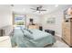 Spacious main bedroom with large bed and pool view at 6518 Senegal Palm Way, Apollo Beach, FL 33572