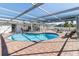 Inviting kidney-shaped pool with screened enclosure at 6518 Senegal Palm Way, Apollo Beach, FL 33572