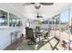 Cozy screened patio with seating and a wet bar at 6518 Senegal Palm Way, Apollo Beach, FL 33572