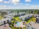 Community pool and surrounding condo buildings at 7701 Starkey Rd # 105, Seminole, FL 33777