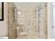 Bathroom with a large glass shower and pebble floor at 7701 Starkey Rd # 105, Seminole, FL 33777
