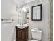 Clean bathroom with dark vanity and a shower at 7701 Starkey Rd # 105, Seminole, FL 33777