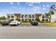Exterior view of building with parking and landscaping at 7701 Starkey Rd # 105, Seminole, FL 33777