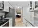Kitchen with white cabinets, granite countertops, and stainless steel appliances at 7701 Starkey Rd # 105, Seminole, FL 33777
