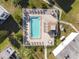 Community pool with surrounding patio and lounge chairs at 7701 Starkey Rd # 105, Seminole, FL 33777