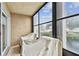 Relaxing screened porch with tiled floor at 7701 Starkey Rd # 105, Seminole, FL 33777