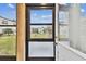 Screened porch with door leading to the yard at 7701 Starkey Rd # 105, Seminole, FL 33777