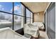 Covered patio with two chairs and view of yard at 7701 Starkey Rd # 105, Seminole, FL 33777