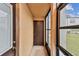 Screened porch with exterior storage closet at 7701 Starkey Rd # 105, Seminole, FL 33777