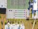 Aerial view of shuffleboard and tennis courts at 7701 Starkey Rd # 105, Seminole, FL 33777