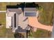 Aerial view of house with solar panels and driveway at 8131 Spring Forest Ln, Wesley Chapel, FL 33544