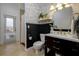 Stylish bathroom with dark vanity, patterned wallpaper, and a shower at 8131 Spring Forest Ln, Wesley Chapel, FL 33544