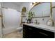 Modern bathroom with dark vanity and gold accents at 8131 Spring Forest Ln, Wesley Chapel, FL 33544