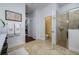 Main bathroom features a walk-in shower, toilet, and tile flooring at 8131 Spring Forest Ln, Wesley Chapel, FL 33544