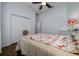 Bedroom with a floral bedspread and wood floors at 8131 Spring Forest Ln, Wesley Chapel, FL 33544