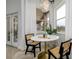 Bright breakfast nook with round table and French doors at 8131 Spring Forest Ln, Wesley Chapel, FL 33544