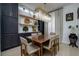 Elegant dining room with dark cabinetry and chandelier at 8131 Spring Forest Ln, Wesley Chapel, FL 33544