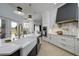 Modern kitchen with farmhouse sink and gold fixtures at 8131 Spring Forest Ln, Wesley Chapel, FL 33544