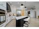Modern kitchen with marble island and stainless steel appliances at 8131 Spring Forest Ln, Wesley Chapel, FL 33544