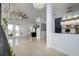 Bright and spacious living area with kitchen views at 8131 Spring Forest Ln, Wesley Chapel, FL 33544