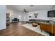 Spacious living room with wood floors and sectional sofa at 8131 Spring Forest Ln, Wesley Chapel, FL 33544