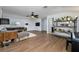 Mid-century modern living room with wood floors at 8131 Spring Forest Ln, Wesley Chapel, FL 33544