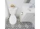 Bathroom with toilet and patterned floor at 8452 Magnolia Dr, Seminole, FL 33777