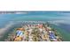 Aerial view showing home's waterfront location at 911 Boca Ciega Isle Dr, St Pete Beach, FL 33706