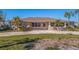 Single story home with a front yard and driveway at 911 Boca Ciega Isle Dr, St Pete Beach, FL 33706